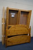 A MODERN PINE 4FT6 BEDSTEAD with four fitted drawers