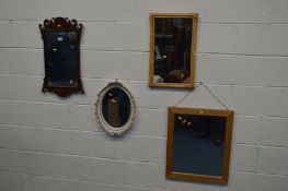 A REPRODUCTION WALNUT FRETWORK WALL MIRROR, 38cm x 64cm and an oak bevelled edge wall mirror and two