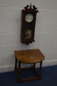 AN OAK DROP LEAF OCCASIONAL TABLE and an oak wall clock (2)