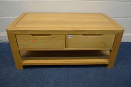 A SOLID LIGHT OAK COFFEE TABLE with two drawers and an undershelf, width 110cm x depth 60cm x height