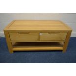 A SOLID LIGHT OAK COFFEE TABLE with two drawers and an undershelf, width 110cm x depth 60cm x height