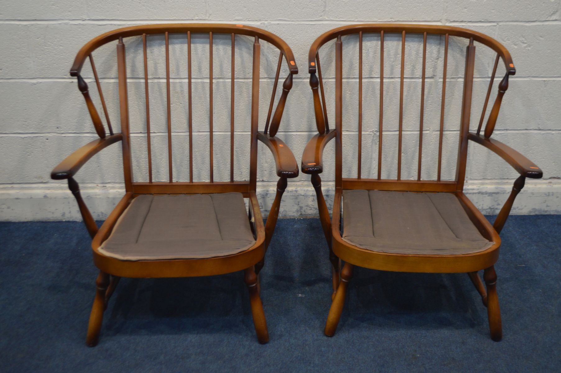 A PAIR OF MID TO LATE 20TH CENTURY BEECH SPINDLE BACK ARMCHAIRS (no cushions)