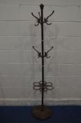 A WROUGHT IRON COAT STAND, with a two tier hooks, with an umbrella stand to the base, height
