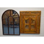 A HARDWOOD AND ORNATE CARVED WALL MIRROR with two spindle doors, 80cm x 90cm along with a modern