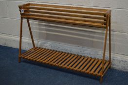 A LONG RECTANGULAR BEECH SLATTED PLANTER, on an A frame united by an undershelf, width 94cm