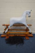 A BESPOKE HANDCRAFTED PAINTED ROCKING HORSE, on a stained pine frame, with separate hair, width