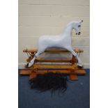 A BESPOKE HANDCRAFTED PAINTED ROCKING HORSE, on a stained pine frame, with separate hair, width