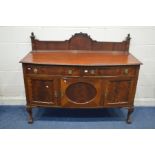 A 20TH CENTURY MAHOGANY BOWFRONT SIDEBOARD, with a shaped raised back, rope detail to the top