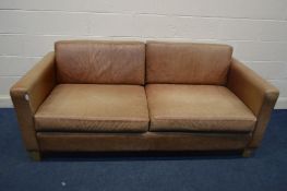 A BROWN LEATHER TWO SEATER SETTEE, on beech legs, width 194cm (sunlight faded leather)