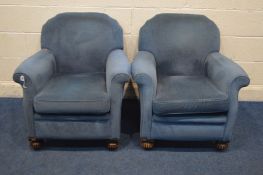 A PAIR OF EARLY 20TH CENTURY BLUE UPHOLSTERED, on carved oak front feet, width 79cm x depth 79cm x