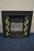 A CAST IRON FIRE PLACE INSERT with green tiles and fire grate, width 92cm x height 97cm