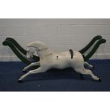 A EARLY VICTORIAN BOW ROCKING HORSE, later painted white and loose from a green painted base,