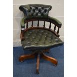 A BUTTONED GREEN LEATHER SWIVEL OFFICE CHAIR