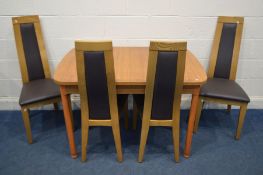 A SET OF FOUR MARKS AND SPENCERS OAK AND BROWN LEATHER DINING CHAIRS and a teak finish extending