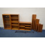 A BEAVER AND TAPLEY 33 TEAK MODULAR WALL SHELVING SYSTEM, comprising of a glazed single door display