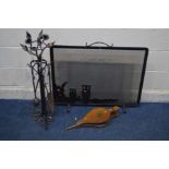 A DECORATIVE WROUGHT IRON FOUR PIECE COMPANION SET, with fruiting vine and flower heads