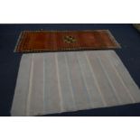 A RED WOOLLEN CARPET RUNNER, 214cm x 81cm and a stripped rug, 185cm x 121cm (stripped carpet