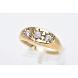 A 9CT GOLD GENTS THREE STONE RING, designed with three star set, circular cut colourless cubic