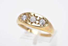 A 9CT GOLD GENTS THREE STONE RING, designed with three star set, circular cut colourless cubic
