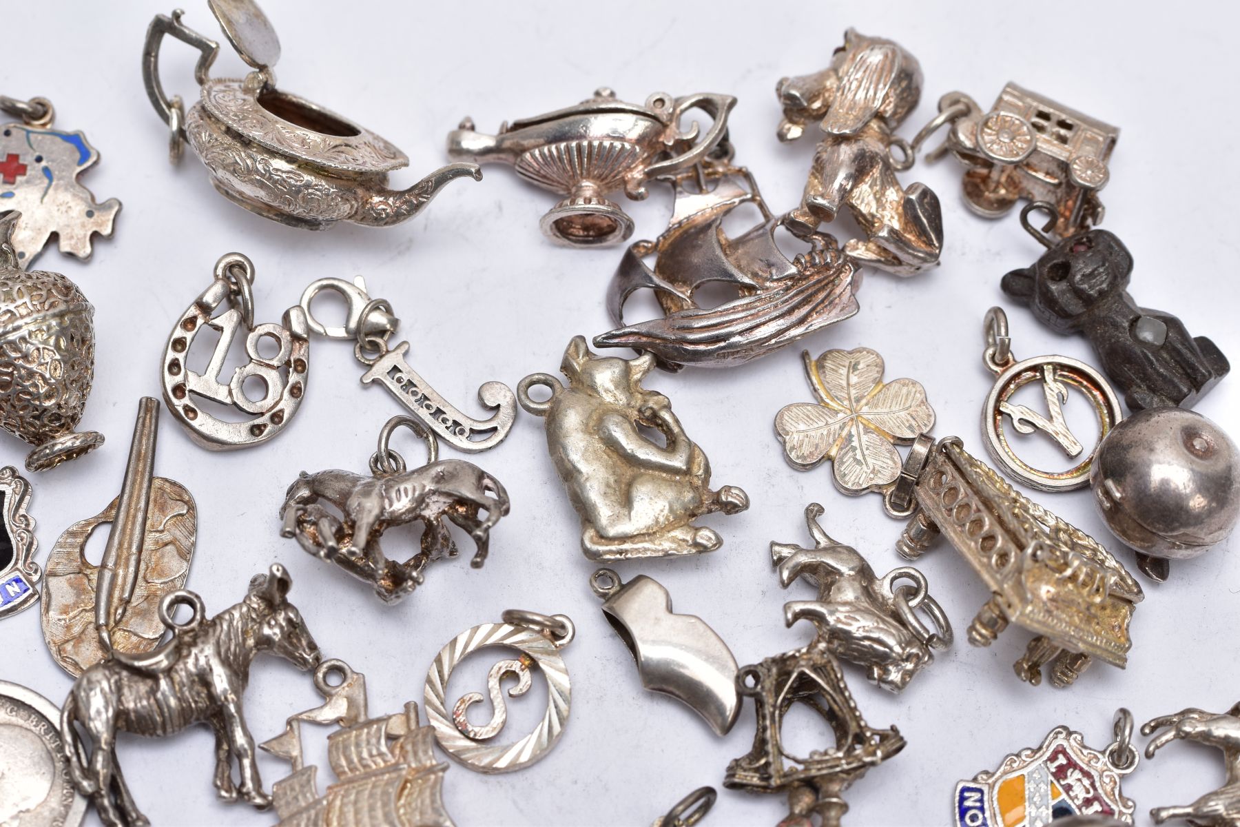A BAG OF ASSORTED SILVER AND WHITE METAL CHARMS, to include sixty four charms in various forms - Image 5 of 7