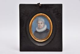 AN 18TH CENTURY PORTRAIT MINIATURE of a grey haired gentleman wearing a frilled collar above black