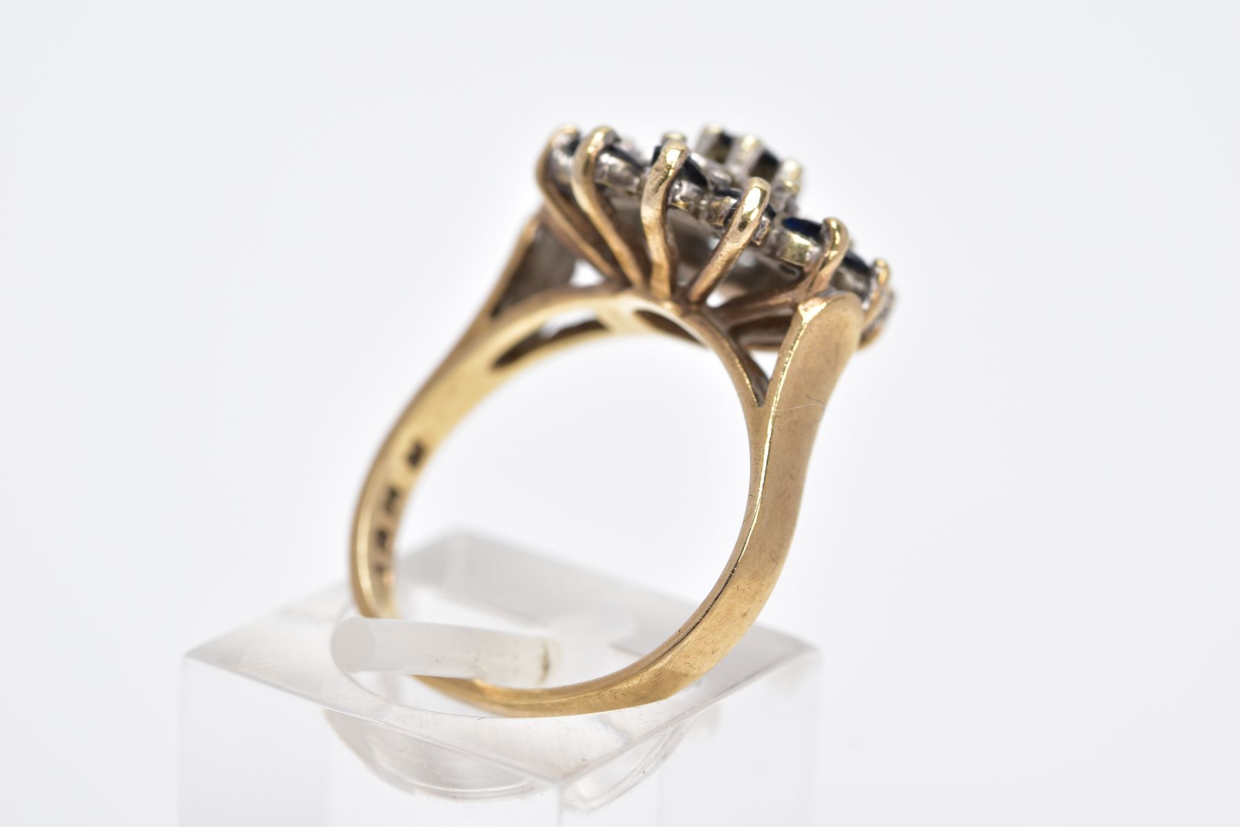 A 9CT GOLD SAPPHIRE AND DIAMOND CLUSTER RING, the raised cluster set with a claw set, circular cut - Image 3 of 4