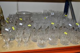 A GROUP OF GLASSWARE, to include various cut glasses, candleholder, vase, a pedestal pressed glass