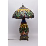 A TIFFANY STYLE TABLE LAMP, Dragonfly design to lamp shade, the baluster shaped body is mounted to a