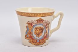 A GEORGE VI TRANSFER PRINTED CORONATION MUG, portraits of the King and his consort to the front,