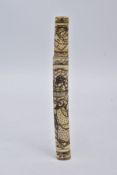 A JAPANESE CARVED BONE KNIFE CASE, the carved bone case decorated with an oriental scene and