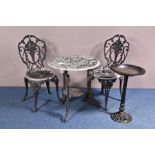 A CAST ALUMINIUM GARDEN TABLE AND TWO MATCHING CHAIRS, rose and foliage design, height of table 65cm