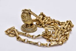 A CONTEMPORARY YELLOW METAL CHAIN WITH OWL FOB, designed with a textured fancy link chain fitted