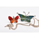 TWO WHITE METAL AND ENAMELLED BUTTERFLY PENDANTS AND A CHAIN, the first butterfly pendant