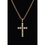 A 9CT GOLD DIAMOND PENDANT NECKLET, the pendant in the form of a cross, set with eleven round