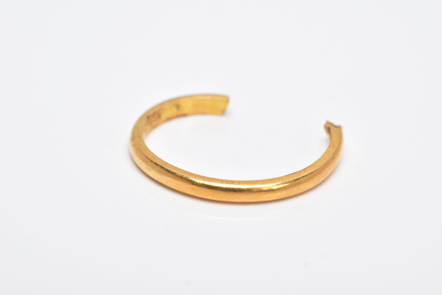 A SPLIT 22CT GOLD BAND, of a plain polished design, split shank, hallmarked 22ct gold Birmingham,