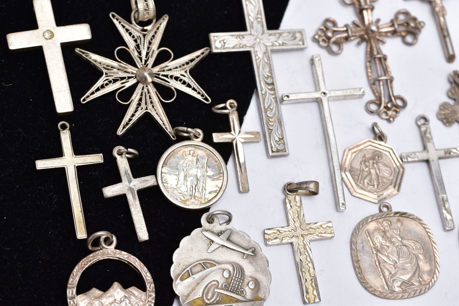 A BAG OF ASSORTED SILVER AND WHITE METAL PENDANTS, to include two silver crosses with hallmarks - Image 2 of 3