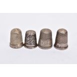 FOUR SILVER THIMBLES, of various designs, with hallmarks for Birmingham and Chester, approximate