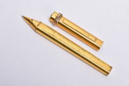 A GOLD PLATED CARTIER BALL POINT PEN, of an engine turn design, twisted tri-coloured detail to the