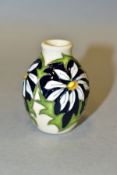A MOORCROFT POTTERY MINIATURE MONTH OF THE YEAR VASE, 'April Daisy' pattern, impressed backstamp and