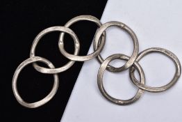 A HEAVY SILVER RING BRACELET, six individual ring links, fitted with a secret clasp, hallmarked '