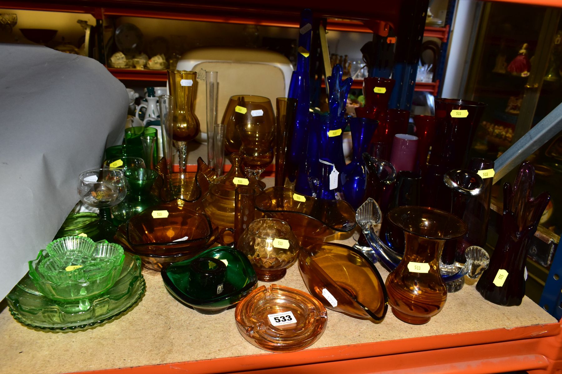 A QUANTITY OF COLOURED GLASS, to include controlled bubble bud vases, Chance handkerchief vase,