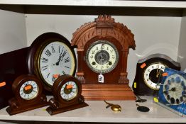 SEVEN VARIOUS MANTEL AND WALL CLOCKS, comprising a late 19th Century walnut cased Ansonia mantel