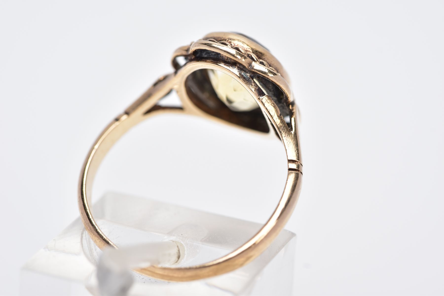 A 9CT GOLD CITRINE RING, designed with a central oval cut citrine within a collet mount, rope - Image 3 of 3