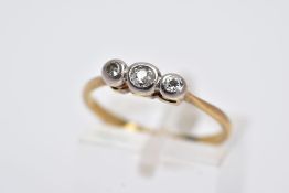 A THREE STONE DIAMOND RING, centring on an old Swiss cut diamond, flanked by a single cut and a
