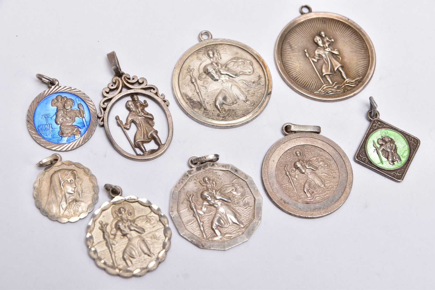 NINE SILVER AND WHITE METAL ST CHRISTOPHER PENDANTS, to include two circular pendants one fitted - Image 2 of 2
