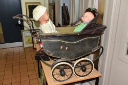 A VINTAGE DOLLS PRAM, appears complete but in need of restoration, wooden body with canvas folding