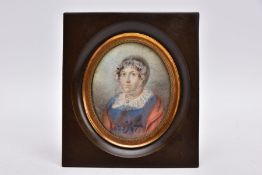 AN EARLY 19TH CENTURY CONTINENTAL PORTRAIT MINIATURE, of a lady wearing a lace cap and collar with a