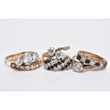 SIX 9CT GOLD GEM SET RINGS, to include a blue sapphire and colourless paste set half eternity ring