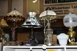 SIX TABLE LAMPS comprising a Tiffany style lamp with elephants to the base and shade,