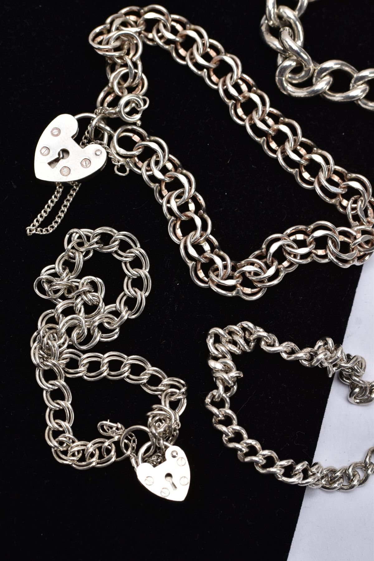 A BAG OF ASSORTED SILVER AND WHITE METAL CHARM BRACELETS, to include three curb link bracelets and - Image 2 of 3